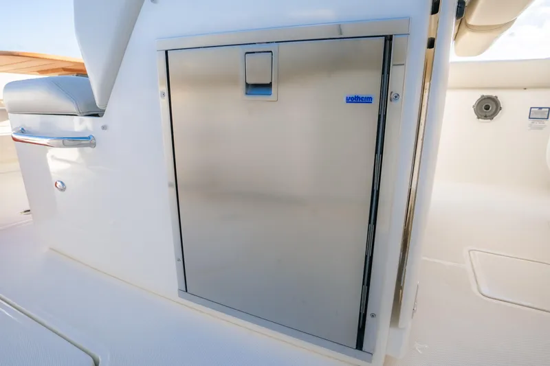 Mama J Yacht Photos Pics Stainless steel storage compartment on 2021 Boston Whaler 330 Outrage boat.