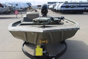 2024 Tracker Grizzly 1754 SC boat on trailer, parked in an RV dealership lot.