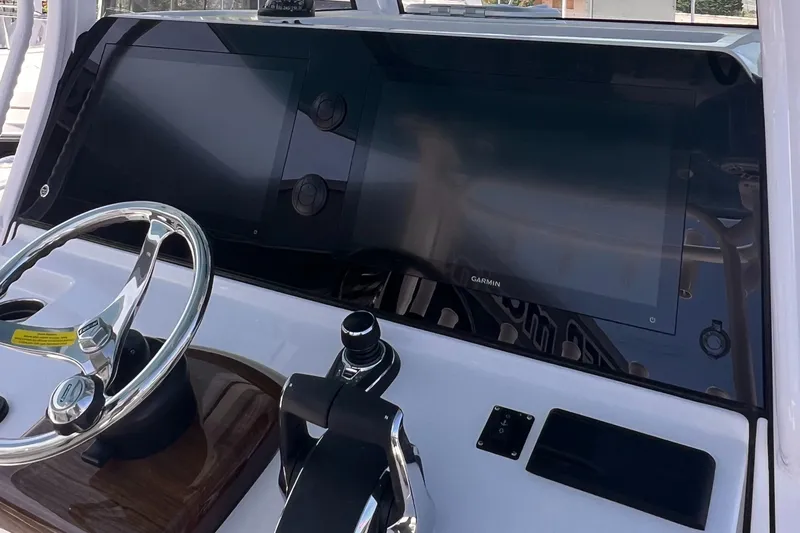  Yacht Photos Pics 2025 Sportsman Open 352 Center Console dashboard with steering wheel and digital displays.