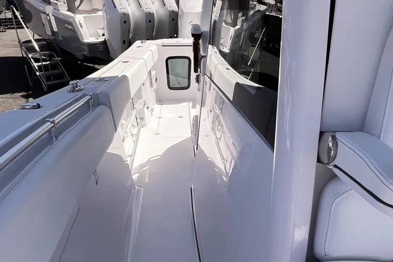  Yacht Photos Pics 2025 Sportsman Open 352 Center Console boat interior, showcasing sleek white deck design.