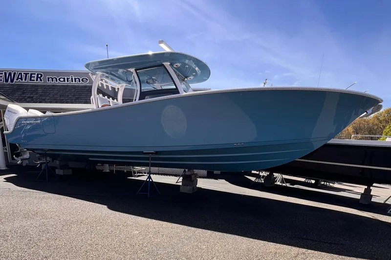  Yacht Photos Pics 2025 Sportsman Open 352 Center Console boat displayed outdoors on a sunny day.