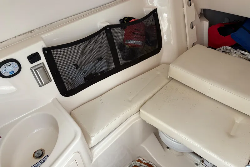  Yacht Photos Pics 2017 Grady-White Freedom 307 boat interior with seating and storage compartments.