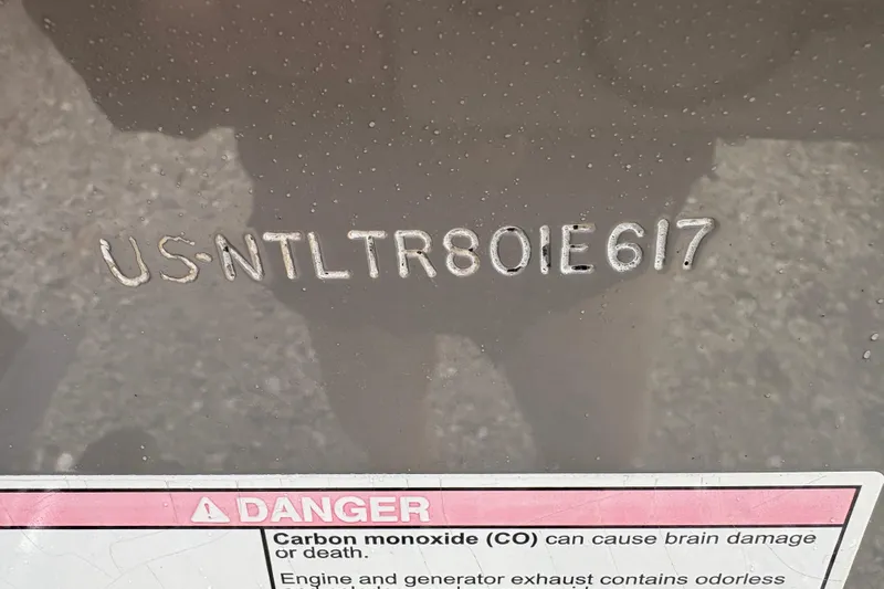  Yacht Photos Pics Hull identification number on 2017 Grady-White Freedom 307 boat with safety warning label.