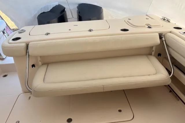  Yacht Photos Pics 2017 Grady-White Freedom 307 boat interior with beige cushioned seating.