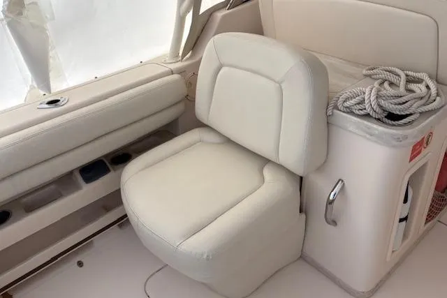  Yacht Photos Pics 2017 Grady-White Freedom 307 boat interior with white seating and storage area.
