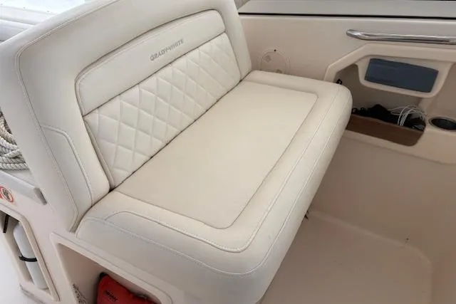  Yacht Photos Pics 2017 Grady-White Freedom 307 boat interior with cushioned seating and storage.