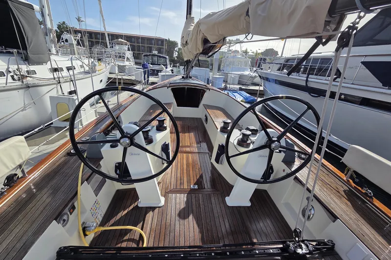 Blue Star Yacht Photos Pics 2018 Tofinou 12 sailboat cockpit with dual steering wheels, docked at marina.