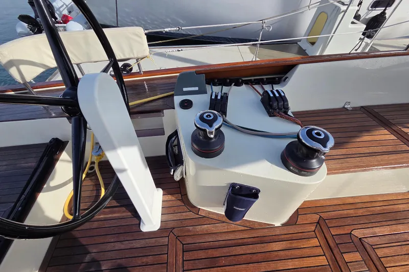 Blue Star Yacht Photos Pics 2018 Tofinou 12 yacht cockpit with wooden deck and steering wheel.