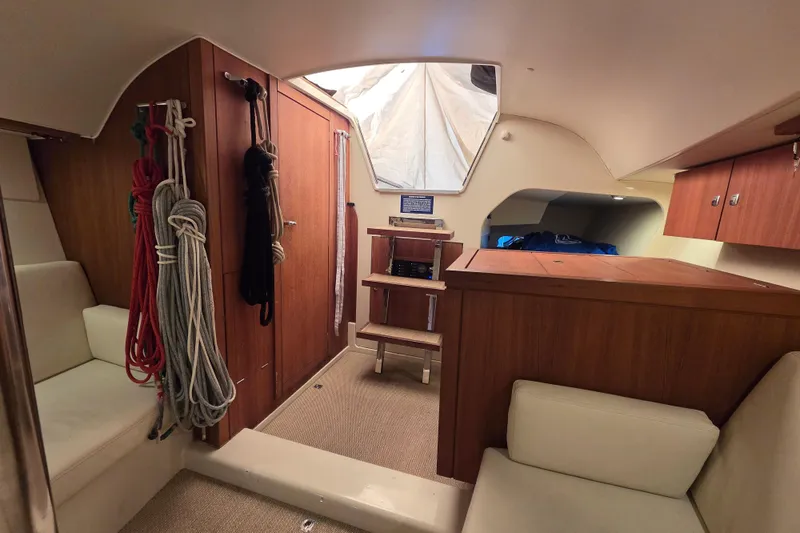 Blue Star Yacht Photos Pics Interior of 2018 Tofinou 12 sailboat with wooden cabinetry and seating.