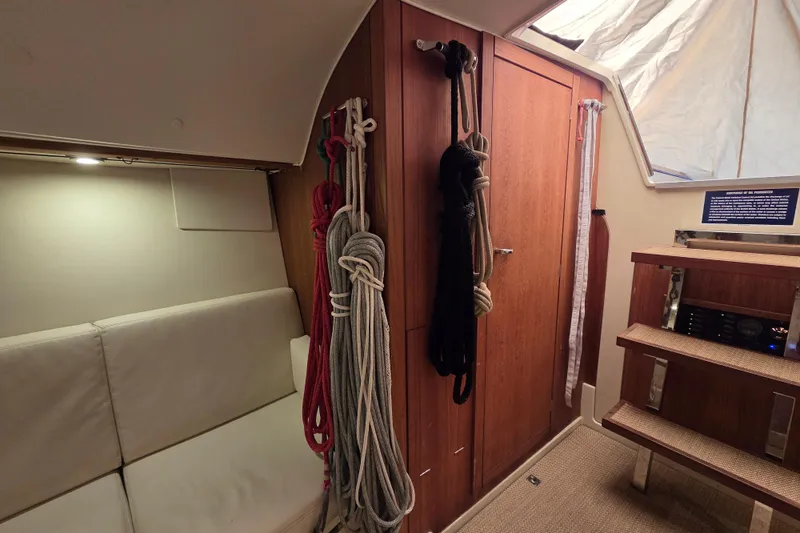 Blue Star Yacht Photos Pics Interior of 2018 Tofinou 12 sailboat with ropes and wooden cabinetry.