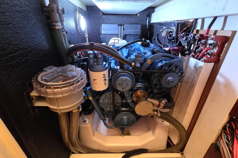 Blue Star Yacht Photos Pics Engine compartment of a 2018 Tofinou 12 sailboat, showcasing detailed mechanical components.