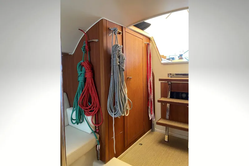 Blue Star Yacht Photos Pics Interior of 2018 Tofinou 12 sailboat with ropes and wooden cabinetry.