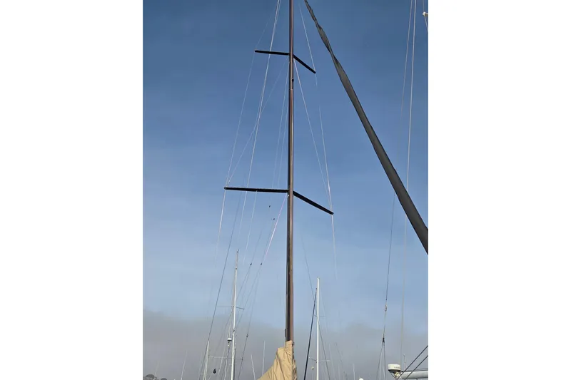 Blue Star Yacht Photos Pics Mast of 2018 Tofinou 12 sailboat against clear blue sky.