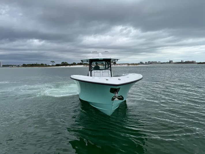  Yacht Photos Pics 2023 Yellowfin 42 Offshore boat cruising on a cloudy day.