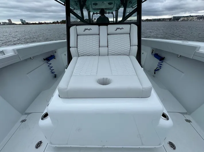  Yacht Photos Pics 2023 Yellowfin 42 Offshore boat with white cushioned seating on deck.