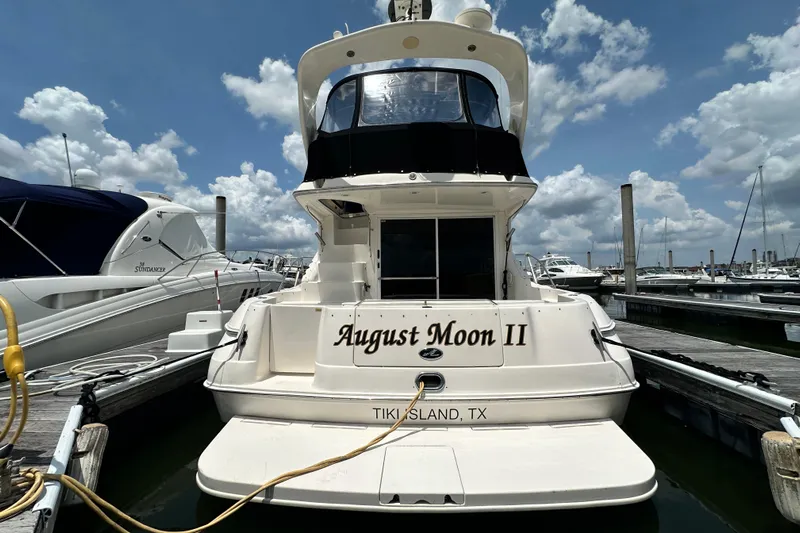 August Moon Yacht Photos Pics 2001 Sea Ray 400 Sedan Bridge yacht docked at marina, named "August Moon II".