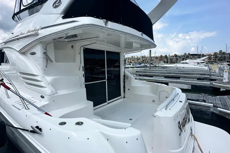 August Moon Yacht Photos Pics 2001 Sea Ray 400 Sedan Bridge yacht docked at marina, showcasing sleek design and spacious deck.