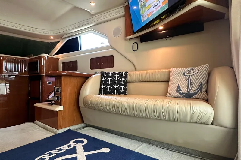 August Moon Yacht Photos Pics Luxurious interior of 2001 Sea Ray 400 Sedan Bridge with nautical-themed decor and modern amenities.