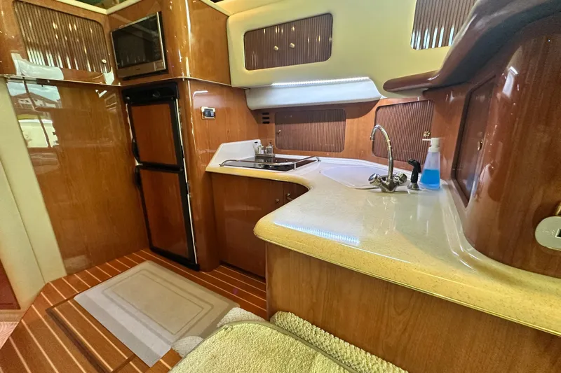 August Moon Yacht Photos Pics Luxurious kitchen interior of 2001 Sea Ray 400 Sedan Bridge yacht.