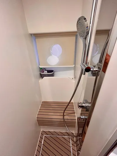  Yacht Photos Pics 2023 Azimut Fly 60 yacht shower with modern fixtures and wooden flooring.