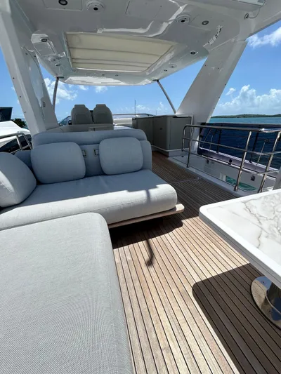  Yacht Photos Pics Luxurious 2023 Azimut Fly 60 yacht deck with elegant seating and ocean view.