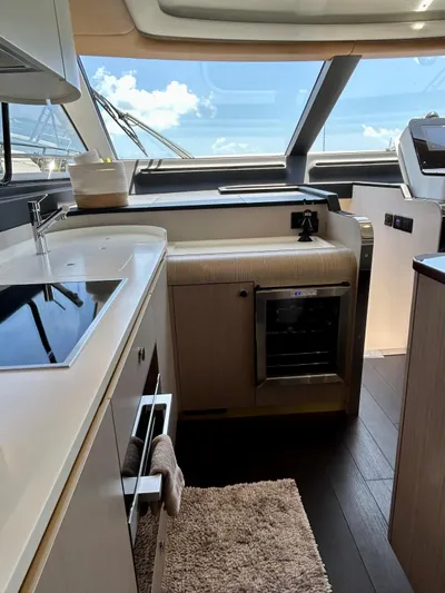  Yacht Photos Pics Luxurious interior of 2023 Azimut Fly 60 yacht with modern kitchen amenities.