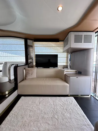  Yacht Photos Pics Luxurious interior of 2023 Azimut Fly 60 yacht with modern sofa and TV.