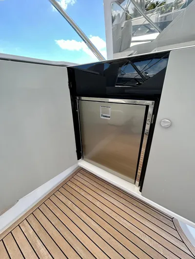  Yacht Photos Pics 2023 Azimut Fly 60 yacht with sleek stainless steel door and teak flooring.