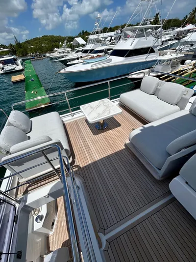  Yacht Photos Pics Luxurious 2023 Azimut Fly 60 yacht with spacious deck and elegant seating at marina.