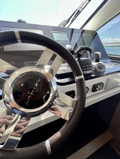  Yacht Photos Pics 2023 Azimut Fly 60 yacht helm with modern controls and steering wheel.