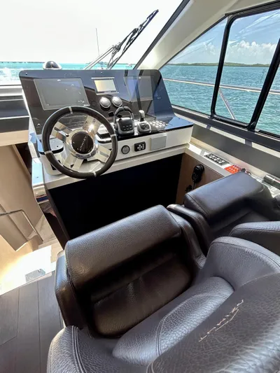  Yacht Photos Pics 2023 Azimut Fly 60 yacht helm with modern controls and ocean view.