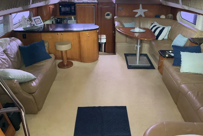 Ware II Go Yacht Photos Pics Interior of 2002 Carver 466 Motor Yacht with cozy seating and modern amenities.