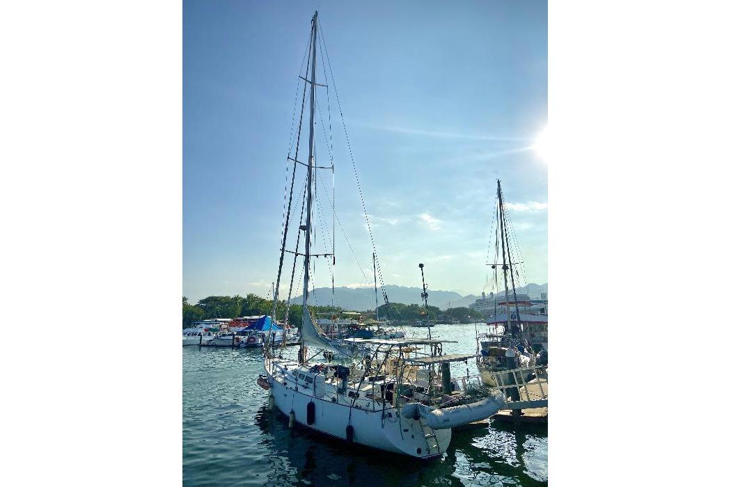 Sailing yacht "Lidgard 60 Racing Cruiser" docked at marina, sunny day, 2001 model.