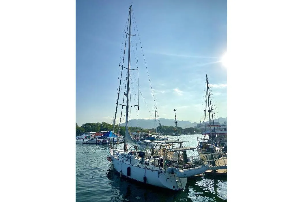 Sailing yacht "Lidgard 60 Racing Cruiser" docked at marina, sunny day, 2001 model.