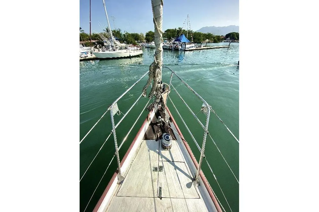 Bow view of 2001 Custom Lidgard 60 Racing Cruiser in marina.