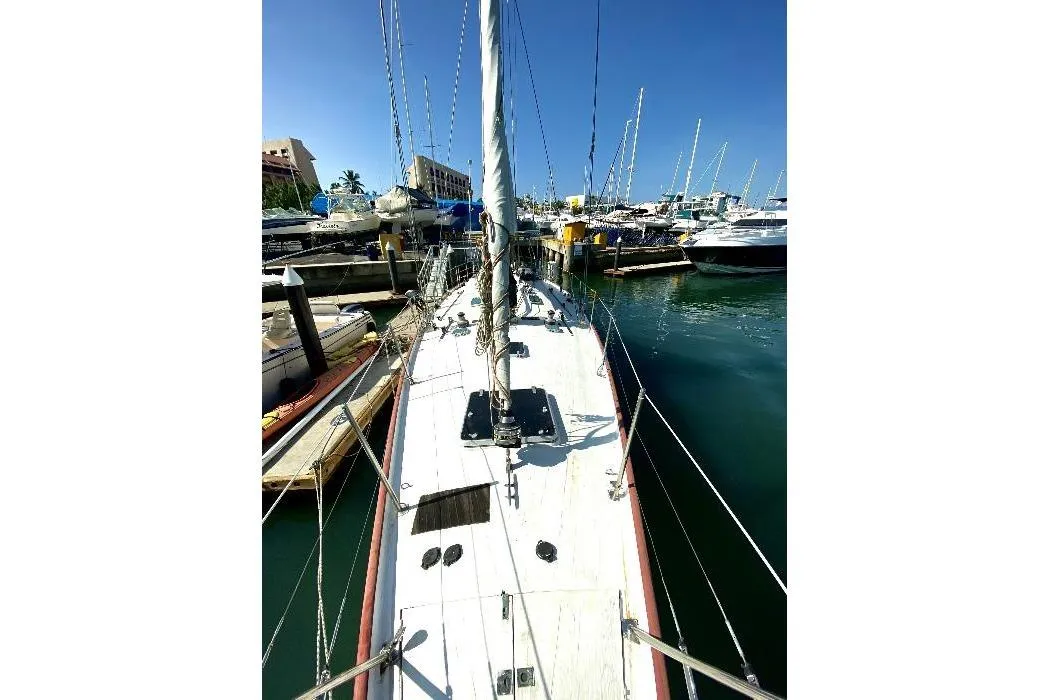 Custom Lidgard 60 Racing Cruiser, 2001, docked in a marina under clear blue skies.