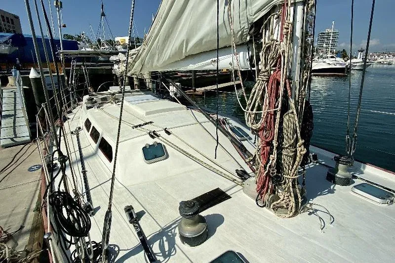 Sailing yacht Lidgard 60 Racing Cruiser, 2001, docked at marina with rigging and sails visible.