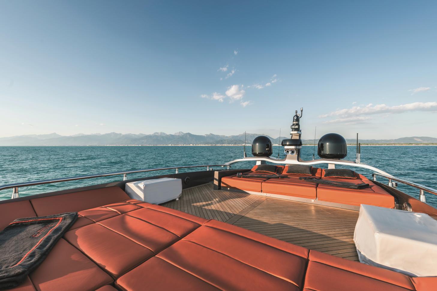 Luxurious AB 80 yacht deck with ocean view, 2025 model, clear skies, and distant mountains.