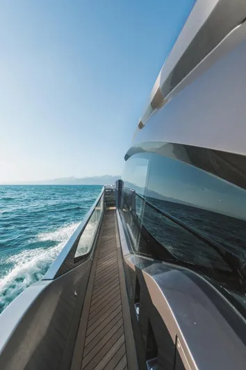  Yacht Photos Pics Sleek AB 80 yacht cruising on open sea, 2025 model, under clear blue sky.