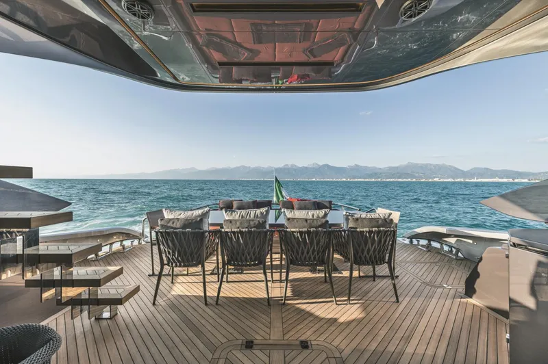  Yacht Photos Pics Luxury yacht deck with dining area, ocean view, and modern design, AB 80, 2025 model.