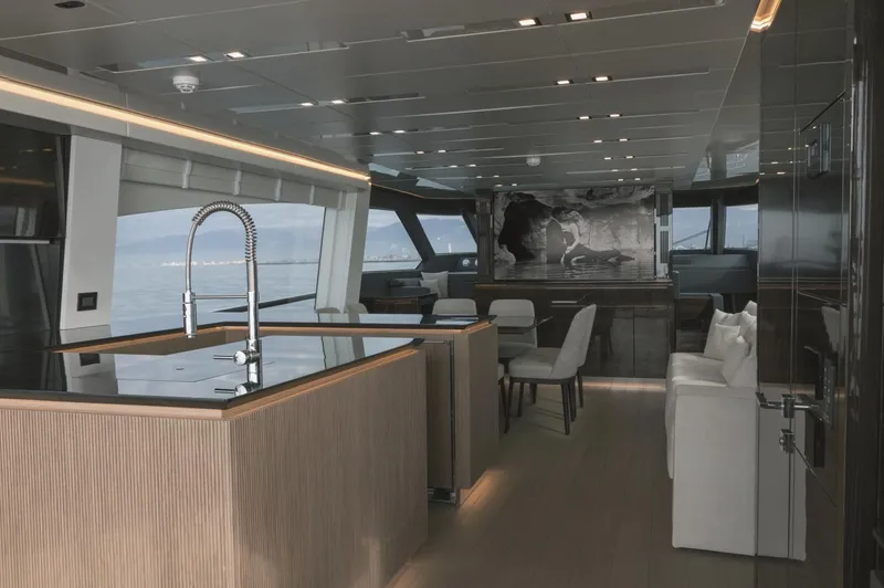  Yacht Photos Pics Luxurious interior of 2025 AB 80 yacht with modern kitchen and seating area.