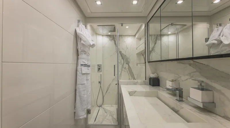  Yacht Photos Pics Luxurious modern bathroom with marble accents and glass shower in AB 80 yacht, 2025 model.