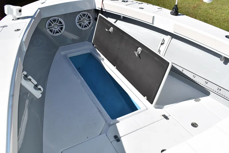  Yacht Photos Pics 2025 Latitude Tournament Boats 25 interior with open storage compartment and speakers.