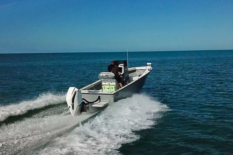  Yacht Photos Pics 2025 Latitude Tournament Boats 25 cruising on open water, showcasing speed and performance.