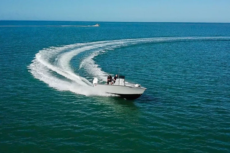  Yacht Photos Pics A 2025 Latitude Tournament Boats 25 making a sharp turn on open water.