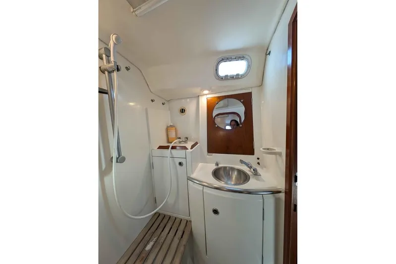 Must Love Dogs Yacht Photos Pics Bathroom interior of 1996 Beneteau 50 yacht with shower and sink.