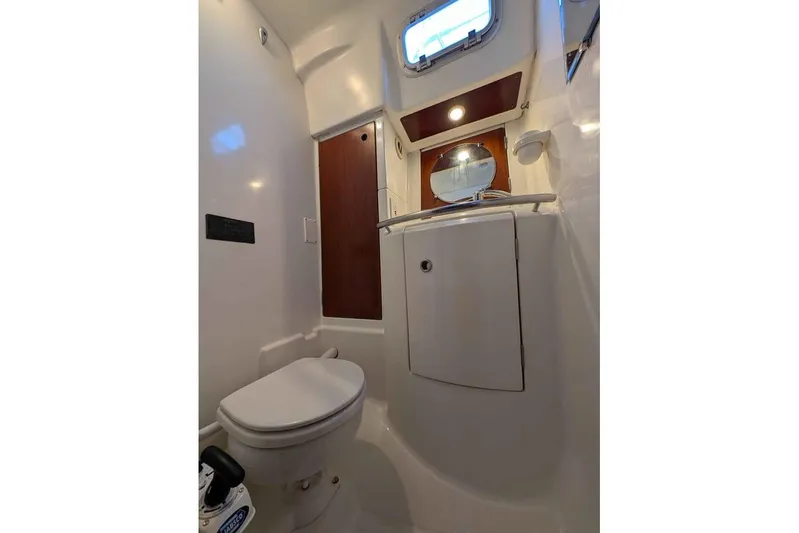 Must Love Dogs Yacht Photos Pics Bathroom interior of 1996 Beneteau 50 yacht, featuring toilet and sink.