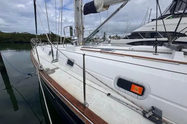 Must Love Dogs Yacht Photos Pics 1996 Beneteau 50 sailboat docked, showcasing deck and rigging details.