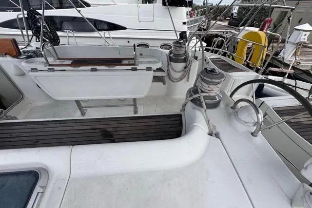 Must Love Dogs Yacht Photos Pics Cockpit view of a 1996 Beneteau 50 sailboat with winches and seating.