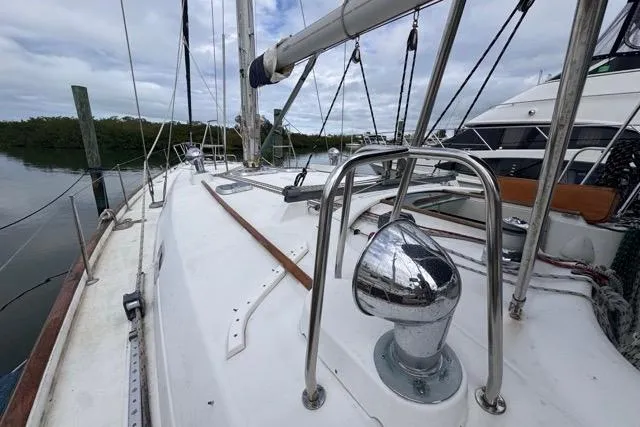 Must Love Dogs Yacht Photos Pics Sailboat deck view of 1996 Beneteau 50, docked with clear skies.
